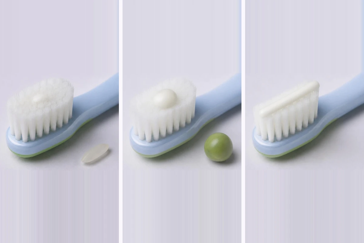 3D illustration of the same child toothbrush three times: a thin smear of toothpaste beside a grain of rice, a pea-sized dab beside a pea, and a line of toothpaste along the whole brush head
