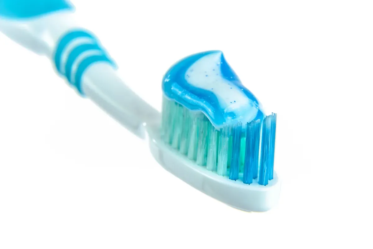 Toothpaste on a toothbrush, ready for brushing